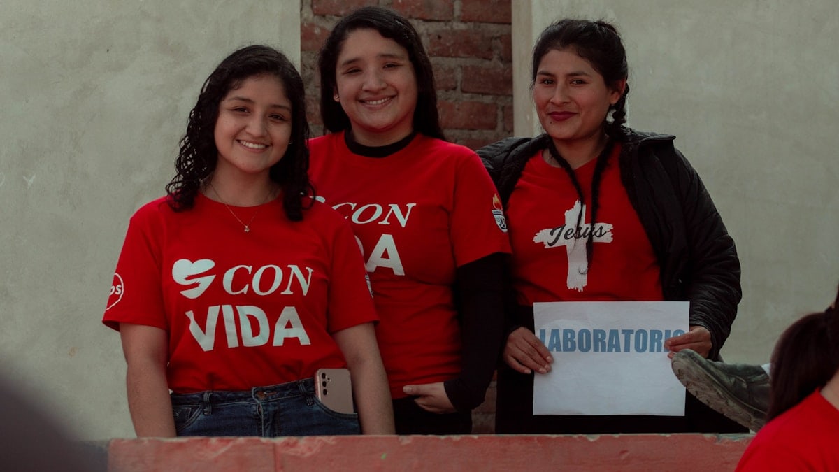 A group of women standing next to each other